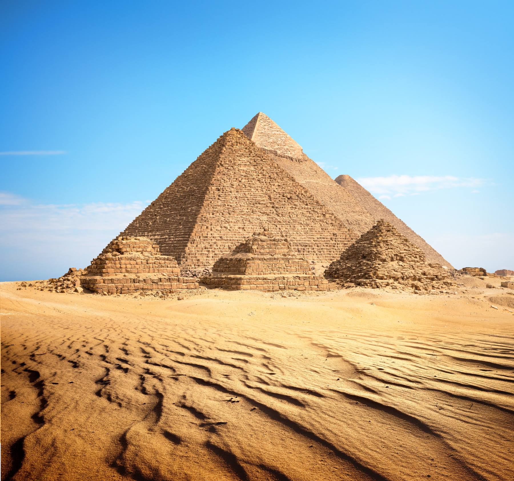 The pyramids of Giza above rippled sand